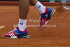 Novak Djokovic (SRB) clears clay off his training shoes during the second round match between Novak Djokovic (SRB) and Andreas Seppi (ITA)  at the ATP Monte Carlo Masters tennis tournament held in the Monte Carlo Country Club, Monaco..
