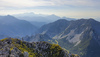 Mountain running to Stol and Vrtaca, mountains in Karavanke, near Trzic, Slovenia. Mountain running is popular sport that takes runners out of cities into unspoiled nature surrounded by highest mountains. Trails around highest Slovenian peaks are astonishingly beautiful, and can offer views over big part of the country if weather plays along.