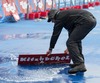 Organizers trying to clear track from water during the women Elite competition of the Triathlon European Championships at the Schwarzsee in Kitzbuehel, Austria on 20.6.2014.
