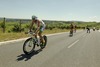 Marino Vanhoenacker (amptierender Triathlon Europameister, Belgium) auf der Radstrecke mit einem Schatten, der wie ein Teufel aussieht // during the Ergo Ironman 70.3 in Remich, Luxembourg on 2014/06/21.
