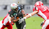 Jaycen Taylor Spears, (SWARCO Raiders Tirol, RB, #7) und Stephen Peyton, (Helsinki Roosters, DB, #30) during quarterfinal match of European Football League between Swarco Raiders Tirol, Innsbruck, Austria, and Helsinki Roosters, Finland. Quarterfinal match of European Football League between Swarco Raiders Tirol and Helsinki Roosters was played on Saturday, 25th of May 2013 in Innsbruck, Austria.
