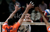 Alan Komel of OK Salonit Anhovo (R) spikes next to Jasmin Cuturic of ACH Volley Bled (L) during first match of Slovenian National Championships finals between ACH Volley, Bled, Slovenia and OK Salonit Anhovo, Slovenia. Match was won by ACH Volley Bled who defeated OK Salonit Anhovo with 3:0. Match was played in Radovljica, Slovenia on 12th of April 2008.
