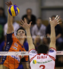 Alen Sket (no.5) of ACH Volley (L) spikes over Alberto Cisolla (no.3) of Lube Banca Marche Macerata (R) during match of CEV Indesit Volleyball Champions League between ACH Volley, Bled, Slovenia and Lube Banca Marche Macerata, 	Macerata, Italy. Match of CEV Indesit Volleyball Champions League between ACH Volley and Lube Banca Marche Macerata was played in Tivoli Arena, Ljubljana, Slovenia, on Wednesday, 10th of February 2010.
