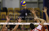 Marko Podrascanin (no.18) of Lube Banca Marche Macerata (M) spikes between Matevz Kamnik (no.7) of ACH Volley (R) and  during match of CEV Indesit Volleyball Champions League between ACH Volley, Bled, Slovenia and Lube Banca Marche Macerata, 	Macerata, Italy. Match of CEV Indesit Volleyball Champions League between ACH Volley and Lube Banca Marche Macerata was played in Tivoli Arena, Ljubljana, Slovenia, on Wednesday, 10th of February 2010.
