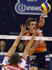 Vid Jakopin (no.15) of ACH Volley (R) spikes over Matias Raymaekers (no.2) of Lube Banca Marche Macerata (L) during match of CEV Indesit Volleyball Champions League between ACH Volley, Bled, Slovenia and Lube Banca Marche Macerata, 	Macerata, Italy. Match of CEV Indesit Volleyball Champions League between ACH Volley and Lube Banca Marche Macerata was played in Tivoli Arena, Ljubljana, Slovenia, on Wednesday, 10th of February 2010.
