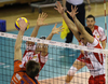Vid Jakopin (no.15) of ACH Volley spikes next to Marko Podrascanin (no.18) of Lube Banca Marche Macerata (L) abnd Matteo Martino (no.10) of Lube Banca Marche Macerata (R) during match of CEV Indesit Volleyball Champions League between ACH Volley, Bled, Slovenia and Lube Banca Marche Macerata, 	Macerata, Italy. Match of CEV Indesit Volleyball Champions League between ACH Volley and Lube Banca Marche Macerata was played in Tivoli Arena, Ljubljana, Slovenia, on Wednesday, 10th of February 2010.
