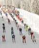 Skiers heading for course after start of Women 15km classic mass start race of Viessmann Cross country skiing FIS World Cup 2009-10. Women 15km classic mass start race of Viessmann Cross country skiing FIS World Cup were held in Rogla, Slovenia, on 20th of December 2009.

