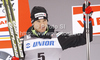 Second placed Dario Cologna of Switzerland celebrates his medal won in men 15km classic race of FIS cross country skiing World cup race in Rogla, Slovenia. Men 15km classic race of FIS cross country skiing World cup was held on Rogla, Slovenia, on Saturday, 17th of December 2011.
