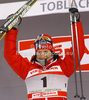 Winner Marit Bjoergen of Norway celebrates her medal won in women sprint free style race of Tour de Ski race of FIS cross country skiing World cup race in Toblach-Dobbiaco, Italy. Women sprint race, stage 6 of Tour de Ski and FIS cross country skiing World cup was held on Toblach-Dobbiaco, Italy, on Wednesday, 4th of January 2012.
