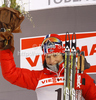 Winner Marit Bjoergen of Norway celebrates her medal won in women sprint free style race of Tour de Ski race of FIS cross country skiing World cup race in Toblach-Dobbiaco, Italy. Women sprint race, stage 6 of Tour de Ski and FIS cross country skiing World cup was held on Toblach-Dobbiaco, Italy, on Wednesday, 4th of January 2012.
