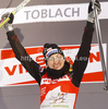 Overall Tour de Ski leader wJustyna Kowalczyk of Poland celebrates after women sprint free style race of Tour de Ski race of FIS cross country skiing World cup race in Toblach-Dobbiaco, Italy. Women sprint race, stage 6 of Tour de Ski and FIS cross country skiing World cup was held on Toblach-Dobbiaco, Italy, on Wednesday, 4th of January 2012.

