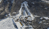 Aerial views of Planica Nordic Center and cross country skiing tracks where FIS Nordic skiing World Championships 2023 will be held in less then month time. Venue is getting ready and workers are preparing last details for World Championships to go through without problems on cold winter morning of 27th of January 2023.