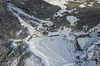 Aerial views of Planica Nordic Center and cross country skiing tracks where FIS Nordic skiing World Championships 2023 will be held in less then month time. Venue is getting ready and workers are preparing last details for World Championships to go through without problems on cold winter morning of 27th of January 2023.