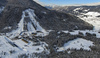 Aerial views of Planica Nordic Center and cross country skiing tracks where FIS Nordic skiing World Championships 2023 will be held in less then month time. Venue is getting ready and workers are preparing last details for World Championships to go through without problems on cold winter morning of 27th of January 2023.