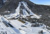 Aerial views of Planica Nordic Center and cross country skiing tracks where FIS Nordic skiing World Championships 2023 will be held in less then month time. Venue is getting ready and workers are preparing last details for World Championships to go through without problems on cold winter morning of 27th of January 2023.