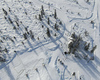 Aerial views of Planica Nordic Center and cross country skiing tracks where FIS Nordic skiing World Championships 2023 will be held in less then month time. Venue is getting ready and workers are preparing last details for World Championships to go through without problems on cold winter morning of 27th of January 2023.