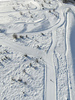 Aerial views of Planica Nordic Center and cross country skiing tracks where FIS Nordic skiing World Championships 2023 will be held in less then month time. Venue is getting ready and workers are preparing last details for World Championships to go through without problems on cold winter morning of 27th of January 2023.