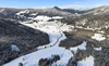 Aerial views of Planica Nordic Center and cross country skiing tracks where FIS Nordic skiing World Championships 2023 will be held in less then month time. Venue is getting ready and workers are preparing last details for World Championships to go through without problems on cold winter morning of 27th of January 2023.