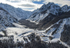 Aerial views of Planica Nordic Center and cross country skiing tracks where FIS Nordic skiing World Championships 2023 will be held in less then month time. Venue is getting ready and workers are preparing last details for World Championships to go through without problems on cold winter morning of 27th of January 2023.