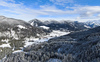 Aerial views of Planica Nordic Center and cross country skiing tracks where FIS Nordic skiing World Championships 2023 will be held in less then month time. Venue is getting ready and workers are preparing last details for World Championships to go through without problems on cold winter morning of 27th of January 2023.