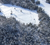 Aerial views of Planica Nordic Center and cross country skiing tracks where FIS Nordic skiing World Championships 2023 will be held in less then month time. Venue is getting ready and workers are preparing last details for World Championships to go through without problems on cold winter morning of 27th of January 2023.