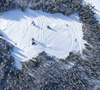 Aerial views of Planica Nordic Center and cross country skiing tracks where FIS Nordic skiing World Championships 2023 will be held in less then month time. Venue is getting ready and workers are preparing last details for World Championships to go through without problems on cold winter morning of 27th of January 2023.