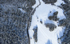 Aerial views of Planica Nordic Center and cross country skiing tracks where FIS Nordic skiing World Championships 2023 will be held in less then month time. Venue is getting ready and workers are preparing last details for World Championships to go through without problems on cold winter morning of 27th of January 2023.