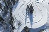 Aerial views of Planica Nordic Center and cross country skiing tracks where FIS Nordic skiing World Championships 2023 will be held in less then month time. Venue is getting ready and workers are preparing last details for World Championships to go through without problems on cold winter morning of 27th of January 2023.