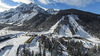 Aerial views of Planica Nordic Center and cross country skiing tracks where FIS Nordic skiing World Championships 2023 will be held in less then month time. Venue is getting ready and workers are preparing last details for World Championships to go through without problems on cold winter morning of 27th of January 2023.