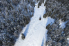 Aerial views of Planica Nordic Center and cross country skiing tracks where FIS Nordic skiing World Championships 2023 will be held in less then month time. Venue is getting ready and workers are preparing last details for World Championships to go through without problems on cold winter morning of 27th of January 2023.