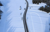 Aerial views of Planica Nordic Center and cross country skiing tracks where FIS Nordic skiing World Championships 2023 will be held in less then month time. Venue is getting ready and workers are preparing last details for World Championships to go through without problems on cold winter morning of 27th of January 2023.