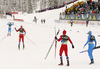 Paal Golberg of Norway (M) and Francesco De Fabiani of Italy (R) celebrate while Johannes Hoesflot Klaebo of Norway (2nd from L) crossing finish line infront of Federico Pellegrino of Italy IL)  skiing during men team sprint finals of  cross country skiing team sprint race of FIS Nordic skiing World Championships 2023 in Planica, Slovenia. Cross country skiing team sprint race of FIS Nordic skiing World Championships 2023 was held in Planica Nordic Center in Planica, Slovenia, on Sunday, 26th of February 2023.