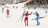 Johannes Hoesflot Klaebo of Norway and Federico Pellegrino of Italy skiing to finish while Paal Golberg of Norway and Francesco De Fabiani of Italy celebrating in finish of the men team sprint finals of  cross country skiing team sprint race of FIS Nordic skiing World Championships 2023 in Planica, Slovenia. Cross country skiing team sprint race of FIS Nordic skiing World Championships 2023 was held in Planica Nordic Center in Planica, Slovenia, on Sunday, 26th of February 2023.