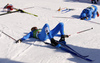 Athletes laying exhausted in finish of the men cross country skiing 50km classic race of FIS Nordic skiing World Championships 2023 in Planica, Slovenia. Men cross country skiing 50km classic race of FIS Nordic skiing World Championships 2023 was held in Planica Nordic Center in Planica, Slovenia, on Sunday, 5th of March 2023.